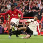 Soccer Football - Premier League - Manchester United v Liverpool - Old Trafford, Manchester, Britain - May 3, 2026 Manchester United's Kobbie Mainoo scores their third goal REUTERS/Chris Radburn