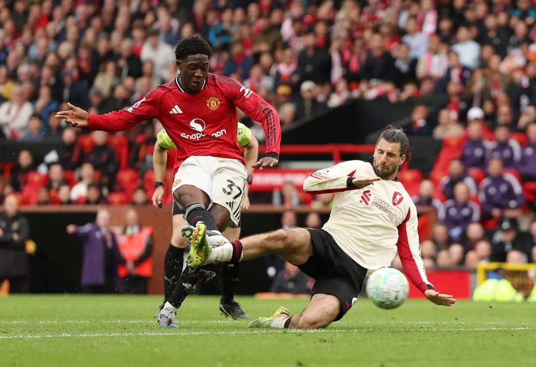 Soccer Football - Premier League - Manchester United v Liverpool - Old Trafford, Manchester, Britain - May 3, 2026 Manchester United's Kobbie Mainoo scores their third goal REUTERS/Chris Radburn